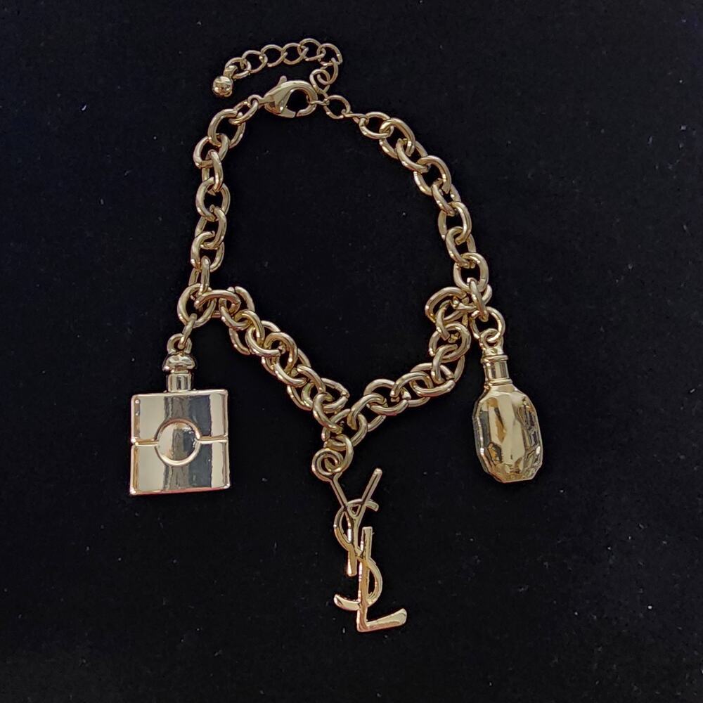 YSL Saint Laurent Gold Tone Charm Bracelet Logo Perfume Bottles NIB - Picture 2 of 8